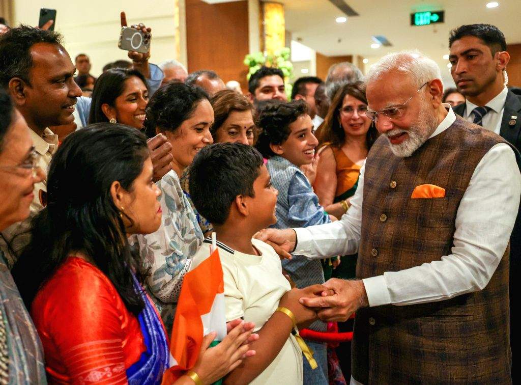 PM Narendra Modi receives a warm welcome from members of the Indian ...