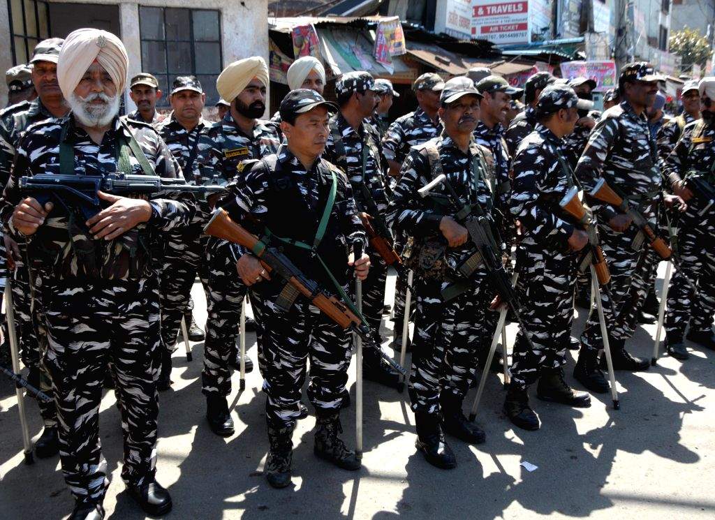 Police and paramilitary forces conduct a flag march ahead of the ...