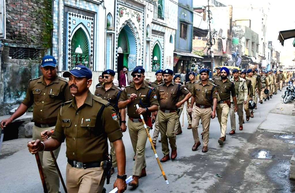 Police Conduct Flag March Ahead of Supreme Court Verdict