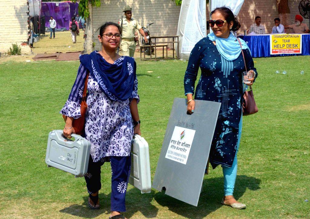 Poll Material Polling officials, along with the election materials leave for their ...