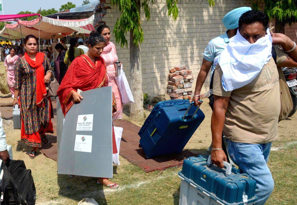 Poll Material Polling officials, along with the election materials leave for their ...