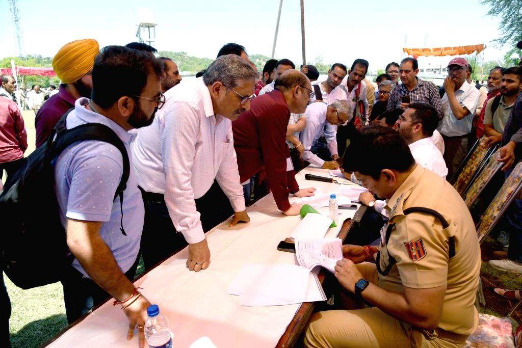Polling officials checking the election related material for the 2nd ...