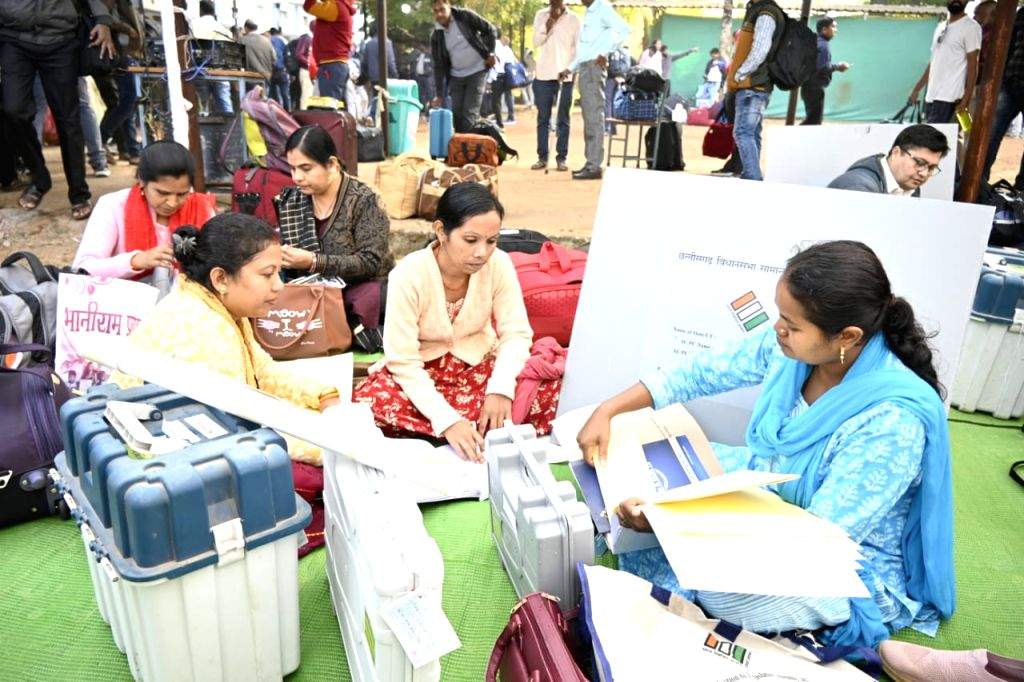 Poll Material Polling officials with EVMs and other election material leave for poll duty