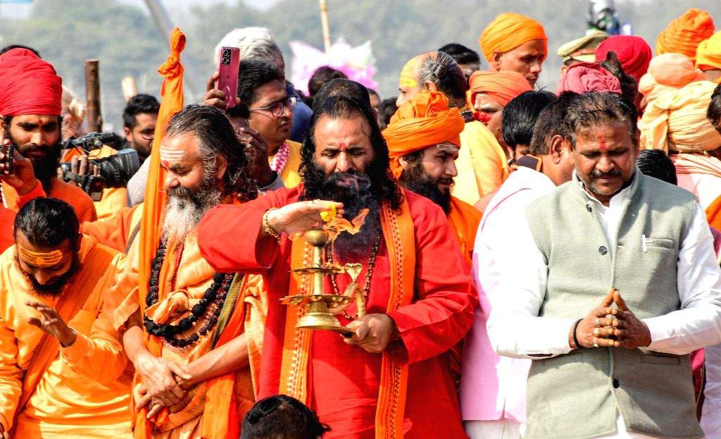 Sadhus perform rituals before participating in the 'Panchkoshi Yatra ...