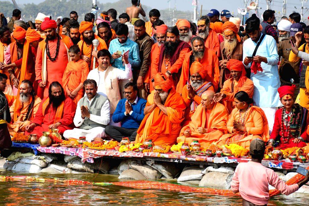 Sadhus perform rituals before participating in the 'Panchkoshi Yatra ...