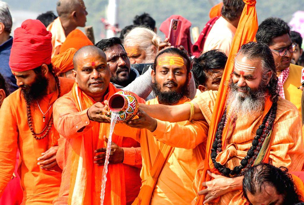 Sadhus perform rituals before participating in the 'Panchkoshi Yatra ...