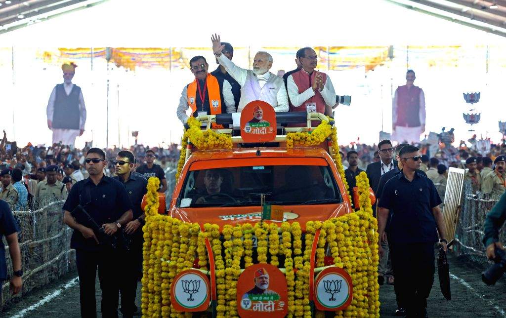 Prime Minister Narendra Modi waves at supporters