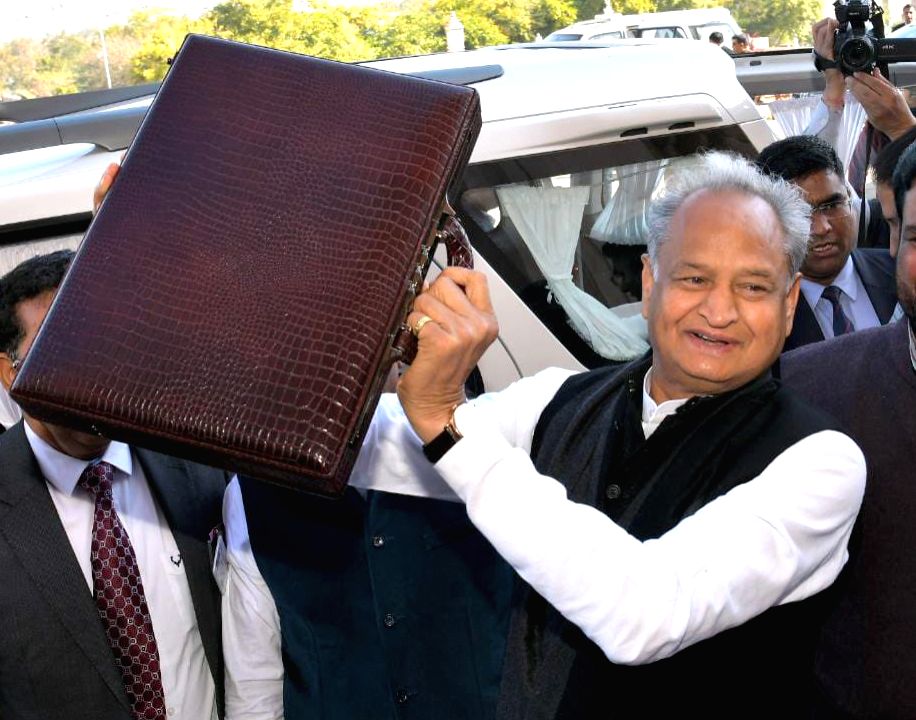 Rajasthan CM Ashok Gehlot displays a briefcase at Vidhan Sabha
