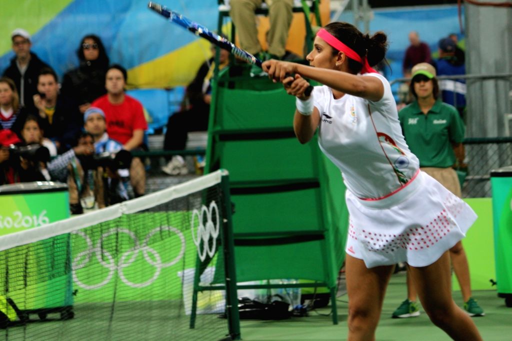 Rio de Janeiro: Tennis - Sania Mirza and Rohan Bopanna in action