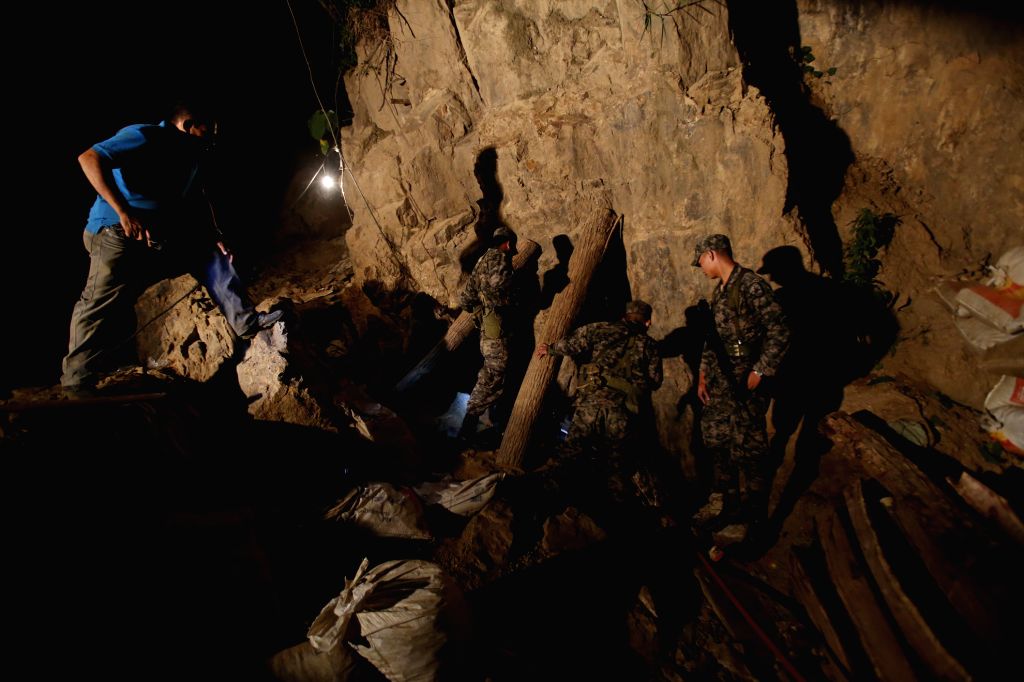 People rescue 11 trapped miners after a collapse in an artisanal gold ...