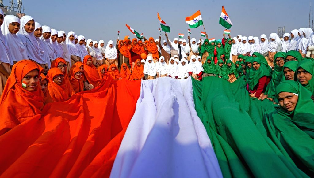 : Ahmedabad : School students hold a huge tri-color on the eve of ...