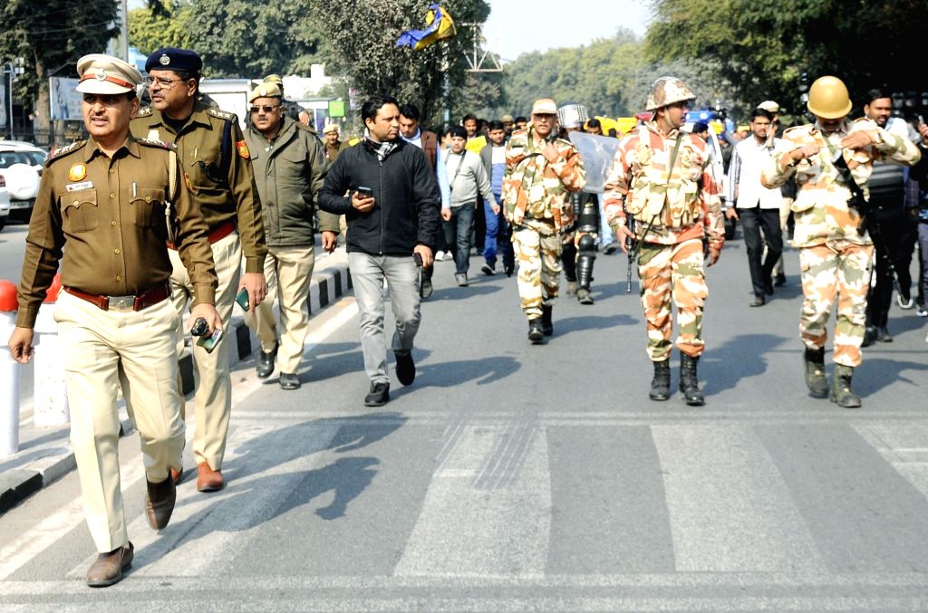 Security personnel during AAP MLAs protest march