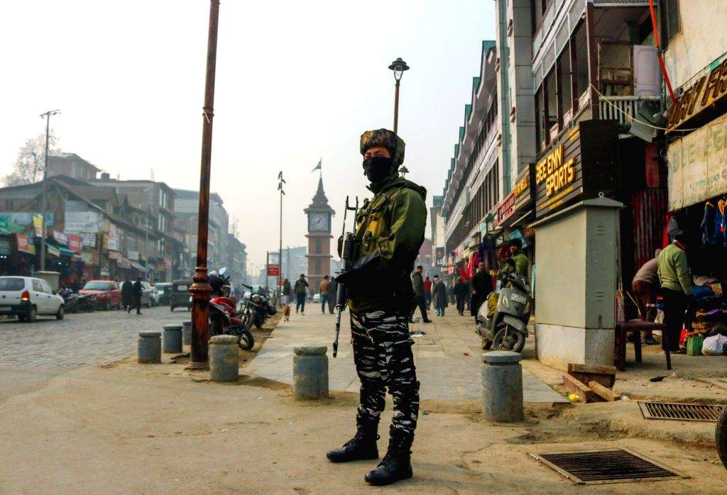 Security personnel stand guard as security is beefed up following the ...