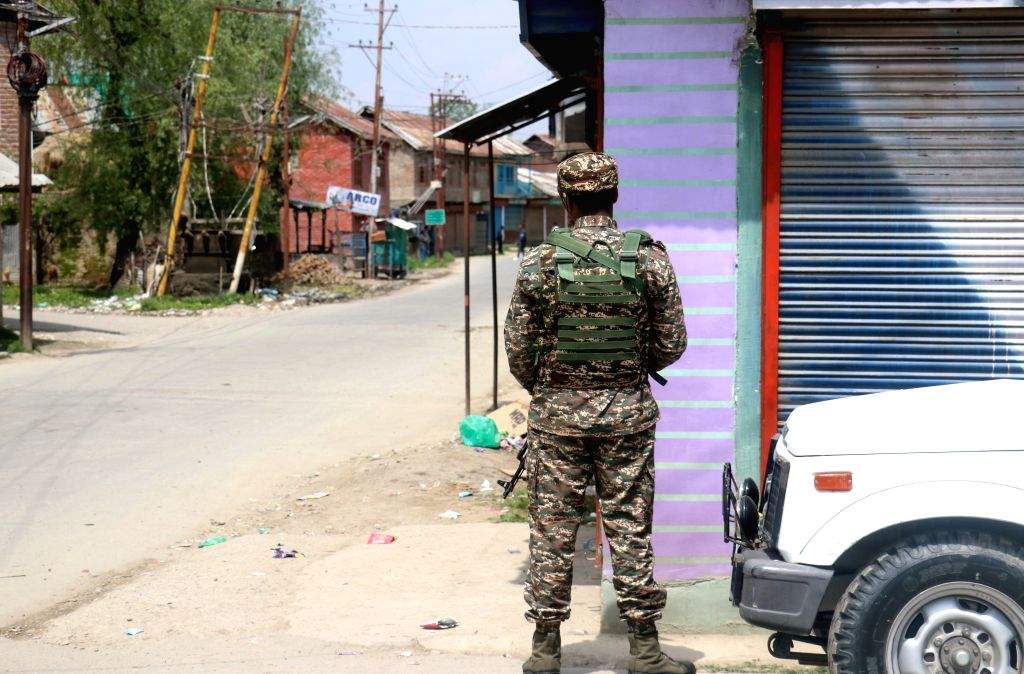 Security personnel stand guard as security is beefed up after an ...