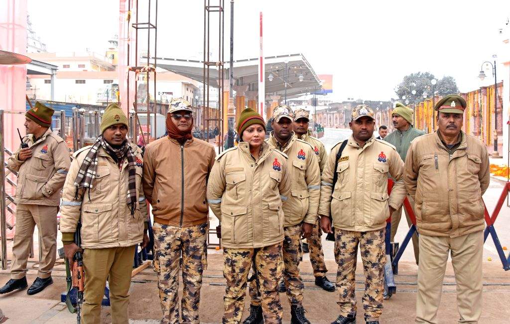 Security personnel stand guard on a road ahead of the Ram temple ...