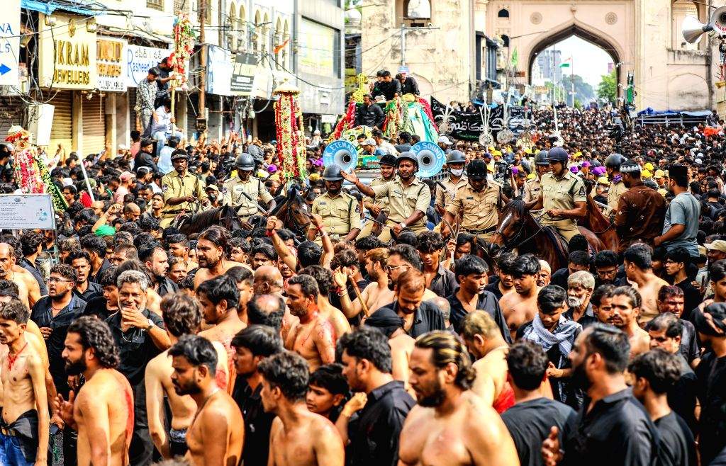 Shia mourners participate in Ashura procession