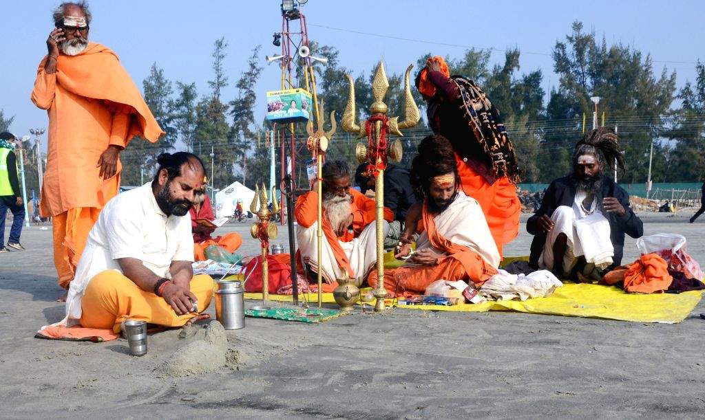 South 24 Parganas: Sadhus (holy men) perform rituals at Gangasagar Island