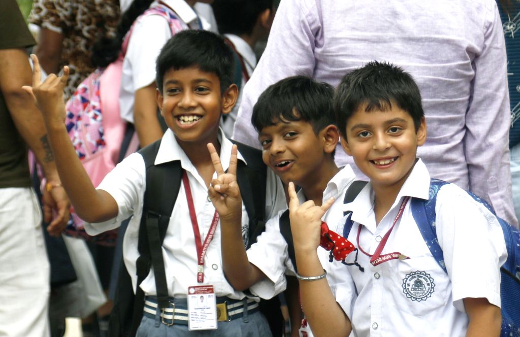 Students leave after attending the first day as schools reopen ...