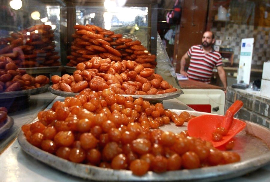 Sweets are for sale at a stand in a market ahead of Eid al-Adha ...