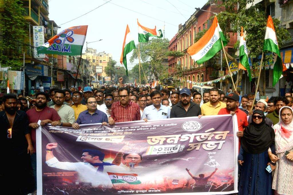 TMC leaders and supporters take out a march in support of their party's ...