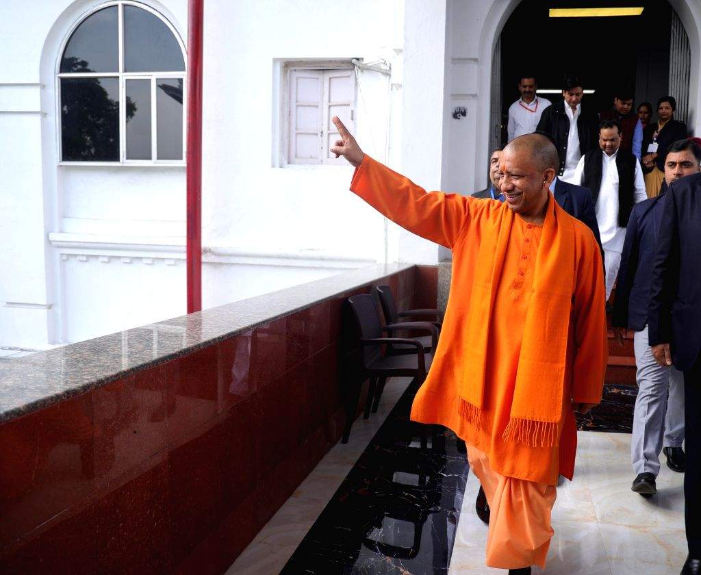 UP CM Yogi Adityanath shows victory sign after casting his vote