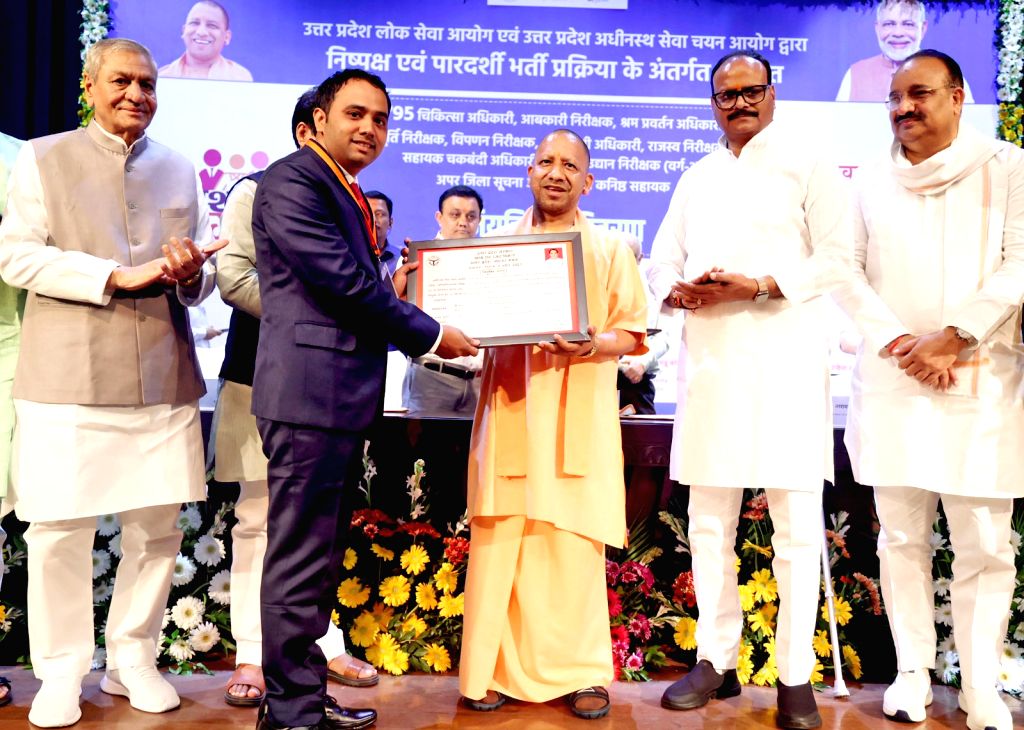 Uttar Pradesh Chief Minister Yogi Adityanath hands over appointment letter