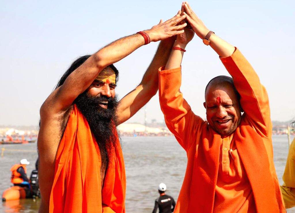 Uttar Pradesh Chief Minister Yogi Adityanath and yoga guru Ramdev ...