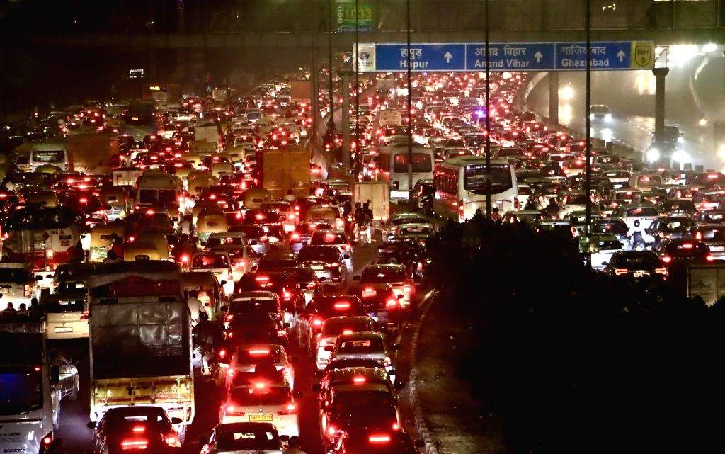 Vehicles are stuck in a traffic jam at NH-24 as festivities for Diwali ...