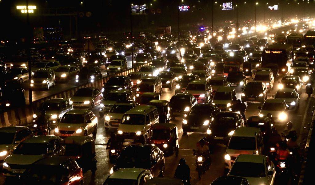 Vehicles are stuck in a traffic jam at NH-24 as festivities for Diwali ...