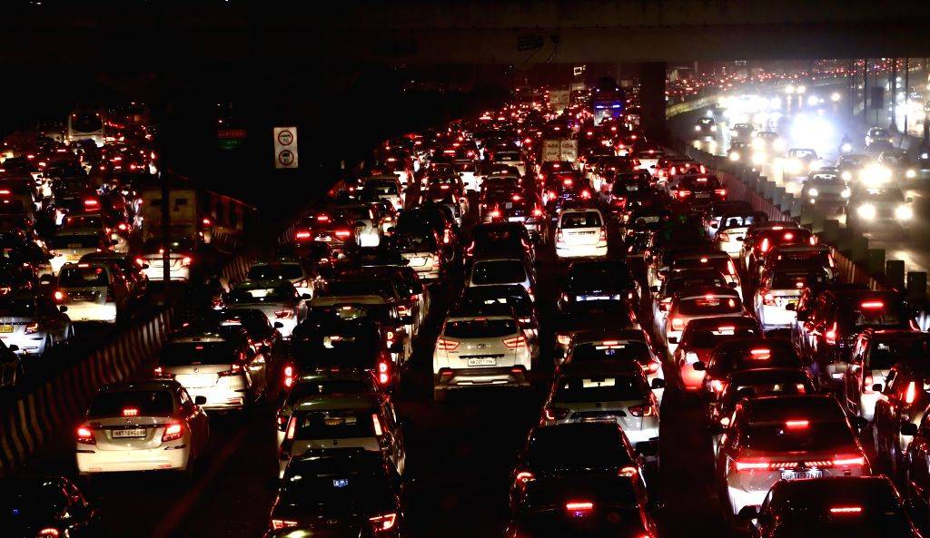 Vehicles are stuck in a traffic jam at NH-24 as festivities for Diwali ...