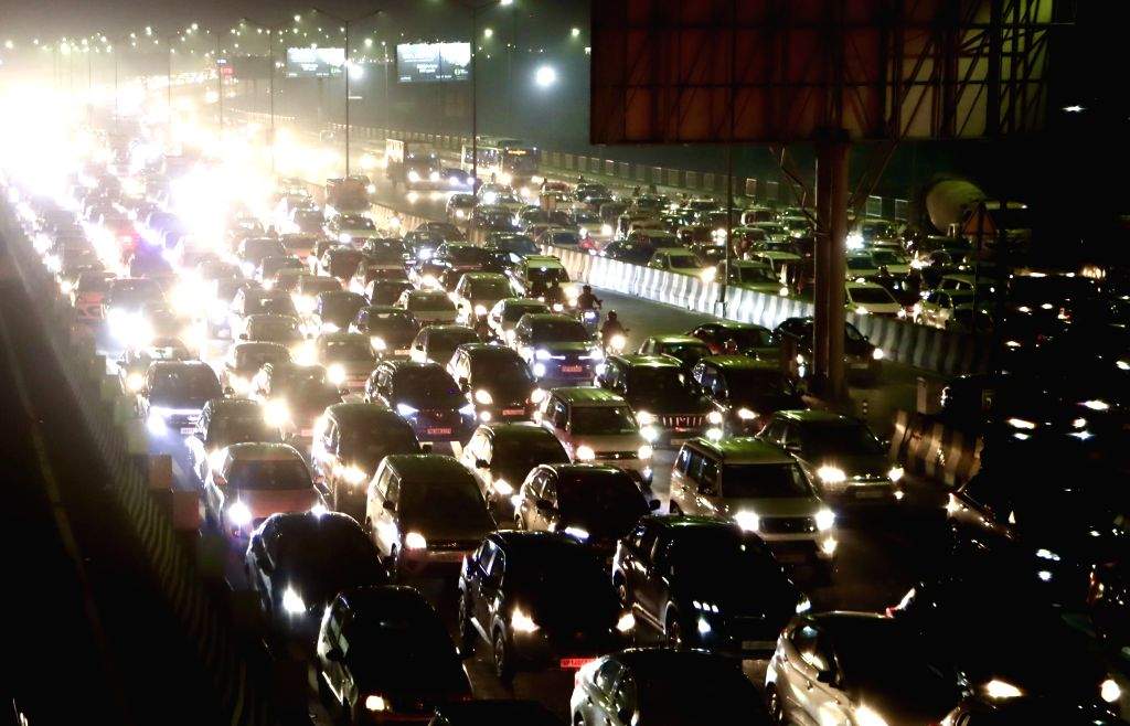 Vehicles are stuck in a traffic jam at NH-24 as festivities for Diwali ...