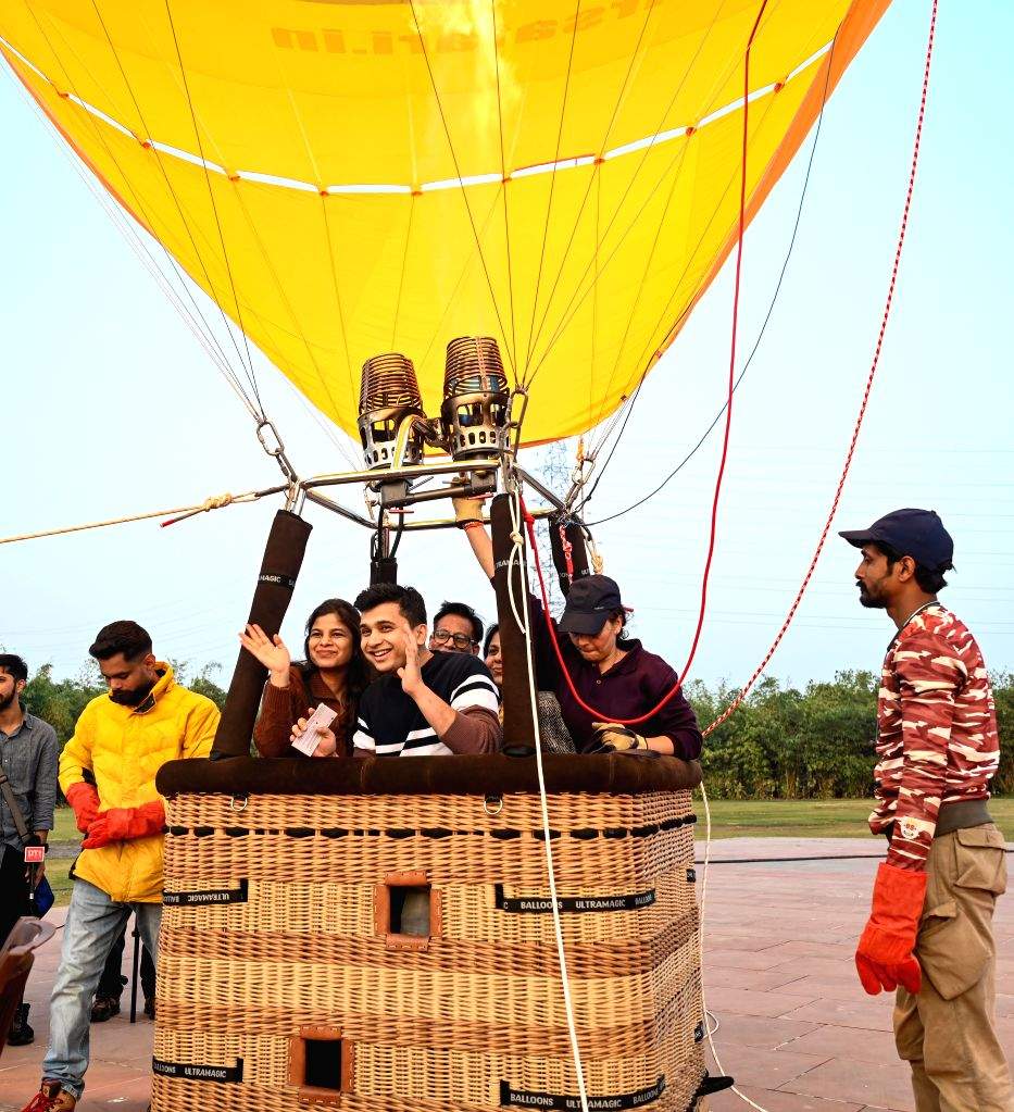 Visitors take the tethered hot air balloon ride at Baansera park