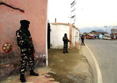 Security personnel stand guard ahead of Prime Minister Narendra Modi's ...