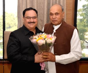 Prem Kumar Dhumal calls on Jagat Prakash Nadda