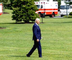 U.S. President Joe Biden walks on the South Lawn to board Marine One at the White House